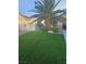 A well-manicured front lawn next to the driveway enhances the curb appeal at 5717 Blizzard Breeze St, North Las Vegas, NV 89081