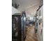 Neutral hallway features wood floors and unique decor at 5717 Blizzard Breeze St, North Las Vegas, NV 89081