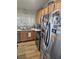 Well-lit kitchen featuring stainless steel appliances and ample counter space at 5717 Blizzard Breeze St, North Las Vegas, NV 89081