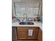 The kitchen sink has stainless steel appliances and a modern faucet fixture at 5717 Blizzard Breeze St, North Las Vegas, NV 89081