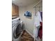 Laundry room including cabinets and washer/dryer at 5717 Blizzard Breeze St, North Las Vegas, NV 89081