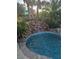 Relax to the soothing sounds of the backyard rock waterfall feature at 5717 Blizzard Breeze St, North Las Vegas, NV 89081