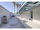 This backyard has a covered patio with a hammock and is ready for outdoor activities and relaxation at 59 N Christy Ln, Las Vegas, NV 89110