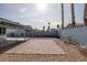 The backyard offers a brick patio, gravel area, and a covered patio, perfect for outdoor relaxation and entertainment at 59 N Christy Ln, Las Vegas, NV 89110