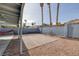 The backyard features a brick patio, gravel area, and covered patio, ideal for outdoor enjoyment at 59 N Christy Ln, Las Vegas, NV 89110