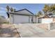 Great view of home, including two car garage and low maintenance front yard at 59 N Christy Ln, Las Vegas, NV 89110