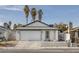 Charming single-story home with a two-car garage and low maintenance front yard at 59 N Christy Ln, Las Vegas, NV 89110