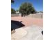 Spacious backyard featuring decorative rock landscaping and a block wall fence for added privacy at 6196 W University Ave, Las Vegas, NV 89103