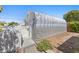 Backyard building features unique architecture, and access through a white picket gate at 636 H Ave, Boulder City, NV 89005