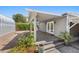Covered backyard patio with stone pavers and access to double French doors at 636 H Ave, Boulder City, NV 89005