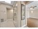 Bright bathroom featuring a glass shower and doorway to a separate room at 636 H Ave, Boulder City, NV 89005