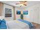 Cozy bedroom with neutral decor, large window, and a spacious closet at 636 H Ave, Boulder City, NV 89005