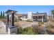 Attractive home featuring a manicured lawn, walkway, and a covered porch entry at 636 H Ave, Boulder City, NV 89005