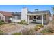 Charming front yard with landscaped features and an inviting entrance to a well-maintained two-story home at 636 H Ave, Boulder City, NV 89005