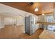 Modern kitchen open to living areas with stainless steel appliances and light countertops at 636 H Ave, Boulder City, NV 89005