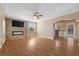Expansive living room with sleek fireplace, hardwood flooring, and an open floor plan at 636 H Ave, Boulder City, NV 89005