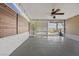 Covered patio shows ample space with ceiling fan, lattice work and outdoor view at 636 H Ave, Boulder City, NV 89005