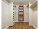 Organized walk-in closet with shelving and wooden storage at 636 H Ave, Boulder City, NV 89005