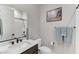 Modern bathroom with a sleek vanity, matte black fixtures, and a tiled shower at 659 Spotted Falcon St, Las Vegas, NV 89138