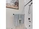 Close-up of a modern bathroom shower with matte black fixtures and light blue towels at 659 Spotted Falcon St, Las Vegas, NV 89138