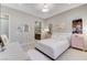 Bedroom with neutral colors, desk and doorway into en suite bathroom at 659 Spotted Falcon St, Las Vegas, NV 89138