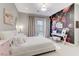 Bedroom with neutral colors, desk and floral wallpaper feature wall at 659 Spotted Falcon St, Las Vegas, NV 89138
