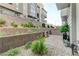 Private courtyard featuring a brick paver patio and decorative landscaping in a modern townhome community at 659 Spotted Falcon St, Las Vegas, NV 89138