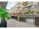Private courtyard featuring a brick paver patio and decorative landscaping in a modern townhome community at 659 Spotted Falcon St, Las Vegas, NV 89138