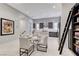 Open dining area with a round table, comfortable seating, and decoratively appointed for a modern aesthetic at 659 Spotted Falcon St, Las Vegas, NV 89138