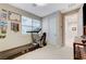Brightly lit home gym equipped with a treadmill and sliding door closet for organized storage at 659 Spotted Falcon St, Las Vegas, NV 89138