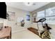 Home gym featuring a treadmill, wall-mounted TV, and exercise equipment for fitness enthusiasts at 659 Spotted Falcon St, Las Vegas, NV 89138