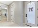 Bright hallway with white trim and doors and sightlines into adjacent rooms and a home gym at 659 Spotted Falcon St, Las Vegas, NV 89138