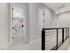 Hallway with modern railings leading to bedrooms with unique decor at 659 Spotted Falcon St, Las Vegas, NV 89138