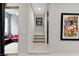 Hallway with carpet, leading to rooms and stairs, decorated with modern art at 659 Spotted Falcon St, Las Vegas, NV 89138
