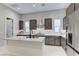 The contemporary kitchen features a center island, stainless steel appliances, and ample counter space at 659 Spotted Falcon St, Las Vegas, NV 89138