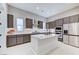 Modern kitchen with stainless steel appliances, a center island, and bright countertops at 659 Spotted Falcon St, Las Vegas, NV 89138