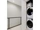 Convenient upstairs laundry area with stacked washer and dryer units for space-saving efficiency at 659 Spotted Falcon St, Las Vegas, NV 89138