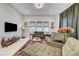 The living room features modern decor, a comfortable seating arrangement, and ample natural light at 659 Spotted Falcon St, Las Vegas, NV 89138
