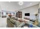 Bright and airy living room showcases a cozy seating arrangement, custom bookshelves, and an open-concept design at 659 Spotted Falcon St, Las Vegas, NV 89138