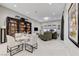 Open-concept living and dining area with stylish furnishings, a bookcase, and recessed lighting at 659 Spotted Falcon St, Las Vegas, NV 89138
