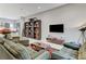 This airy living room features an open layout, stylish furnishings, and custom bookshelves at 659 Spotted Falcon St, Las Vegas, NV 89138
