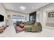 A stylish living room features modern furnishings, a colorful rug, and natural light from the windows at 659 Spotted Falcon St, Las Vegas, NV 89138