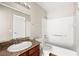 Bright bathroom with a granite-topped vanity and shower-tub combination at 6800 E Lake Mead Blvd # 1018, Las Vegas, NV 89156