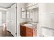 A lovely bathroom features a wooden vanity and a decorative granite countertop at 6800 E Lake Mead Blvd # 1018, Las Vegas, NV 89156