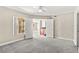 This bedroom features double doors, soft carpet, and a ceiling fan at 6800 E Lake Mead Blvd # 1018, Las Vegas, NV 89156