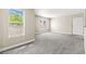 Bedroom featuring neutral walls, gray carpeting, bright windows, and ample natural light at 6800 E Lake Mead Blvd # 1018, Las Vegas, NV 89156