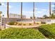 Mountainside Condominiums sign surrounded by lush greenery and desert landscaping, offering a serene welcome at 6800 E Lake Mead Blvd # 1018, Las Vegas, NV 89156