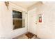 Inviting condo entrance with white door, window, and welcome mat at 6800 E Lake Mead Blvd # 1018, Las Vegas, NV 89156