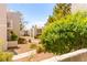 View of the complex with green landscaping at 6800 E Lake Mead Blvd # 1018, Las Vegas, NV 89156
