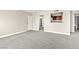 Large unfurnished living room flows into the kitchen and bathroom at 6800 E Lake Mead Blvd # 1018, Las Vegas, NV 89156
